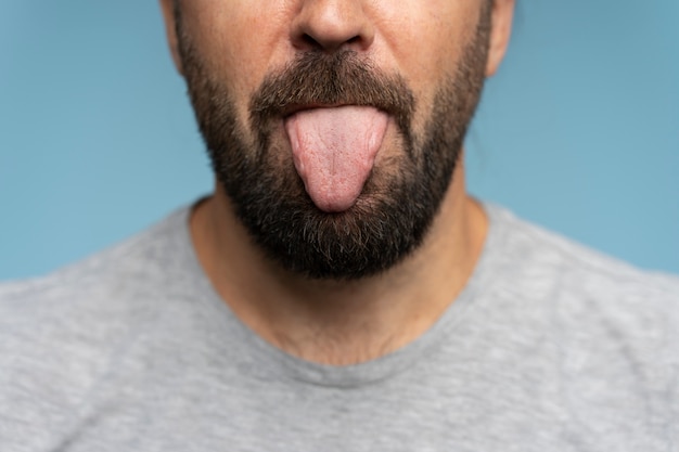 Man sticking out the tongue front view