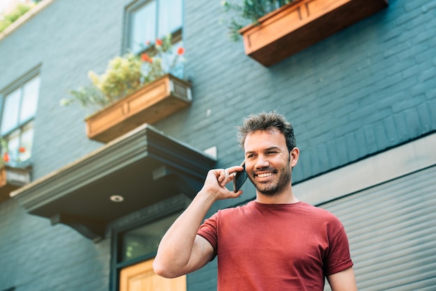 Man on the street using mobile phone