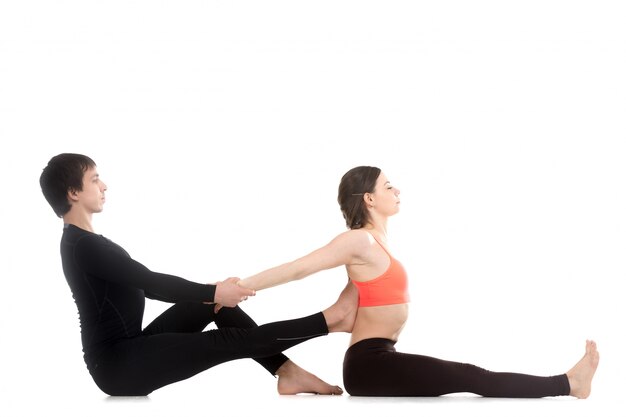 Man stretching arms of a woman