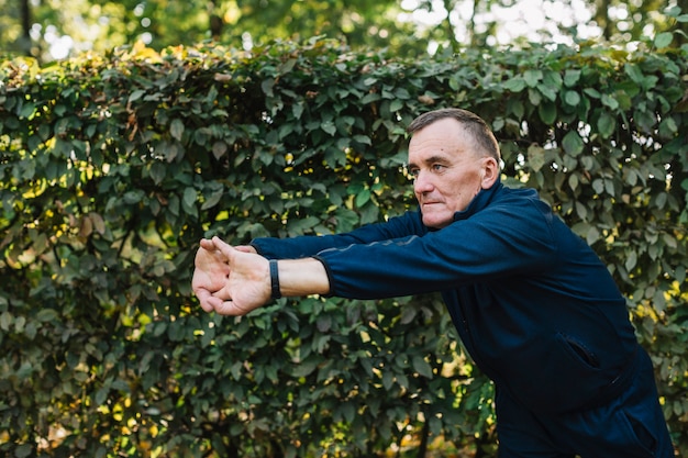 Man stretching his hands in front