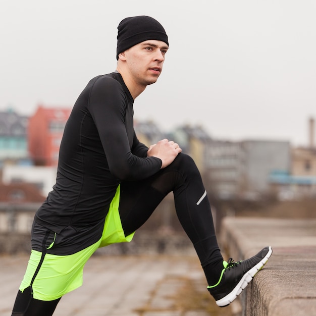 Man stretching leg