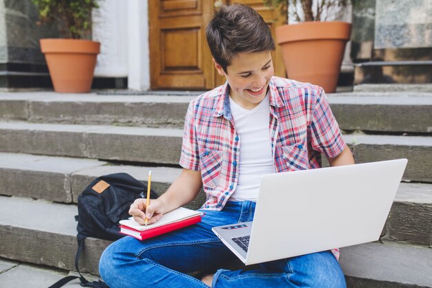 Man studying on stairs