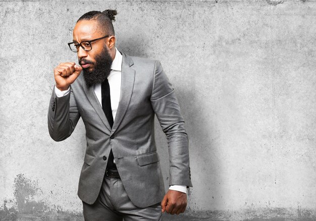 Man in suit coughing