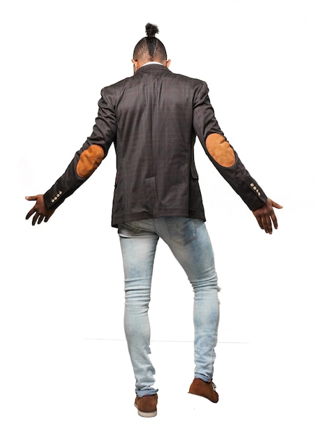 Free photo man in suit and jeans on his back