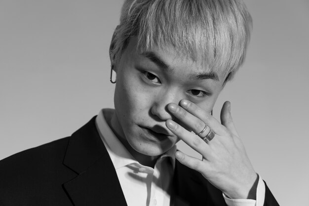 Man in suit posing black and white front view