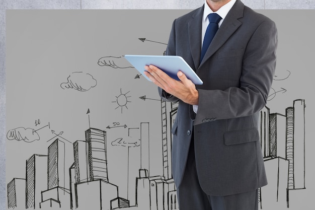 Free photo man in suit with a tablet and background of a city drawn