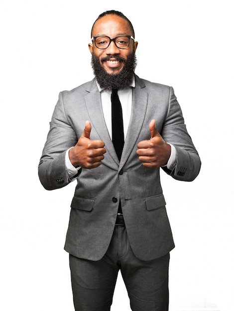 Free photo man in suit with thumbs up