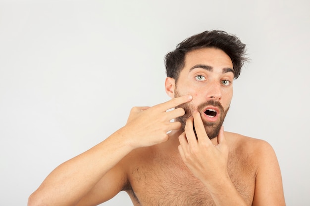 Man surprised with a new pimple 
