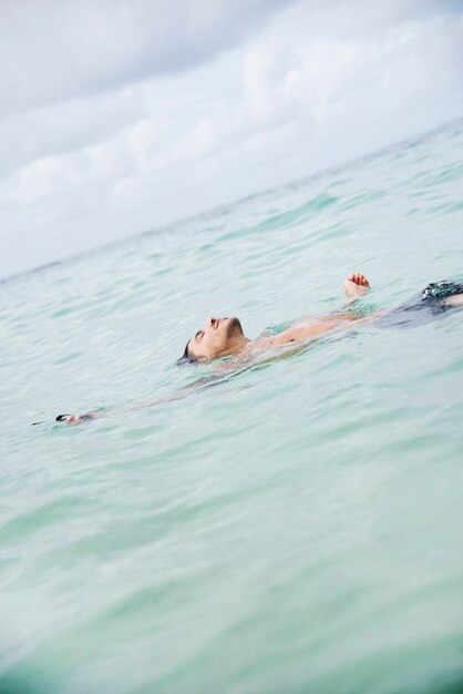  man swimming in the ocean