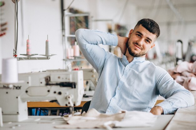 Man tailor working at a sewing factory