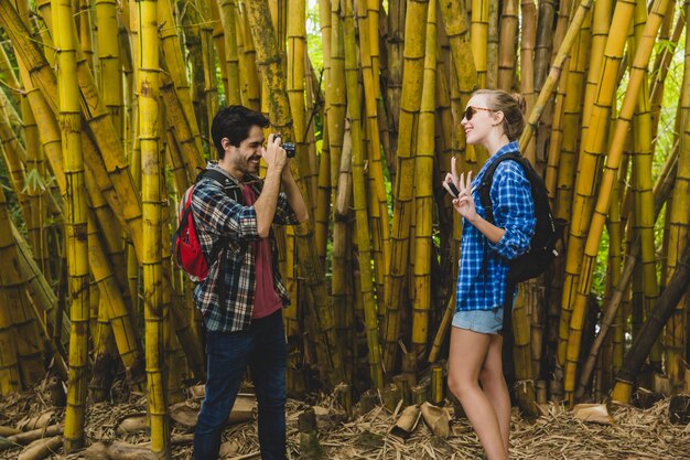 Man takes photo of girlfriend in bamboo forest