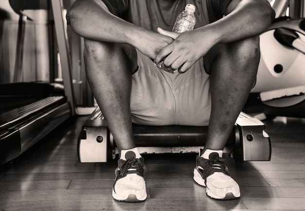 Man taking a break from a workout