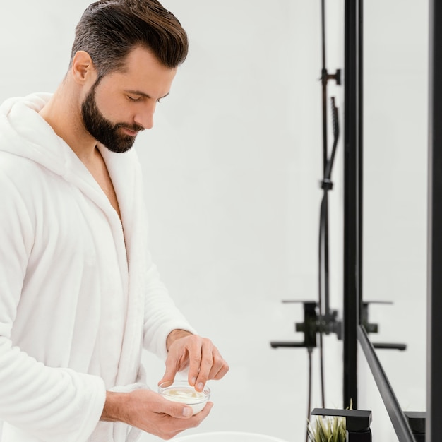 Man taking good care of his face at home