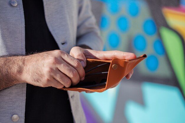 Man taking money from his wallet