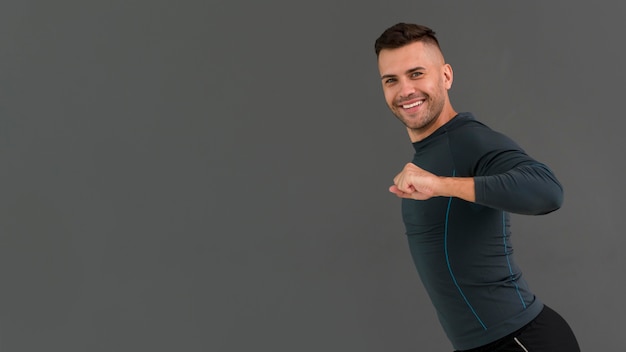 Man taking part in zumba class with copy space