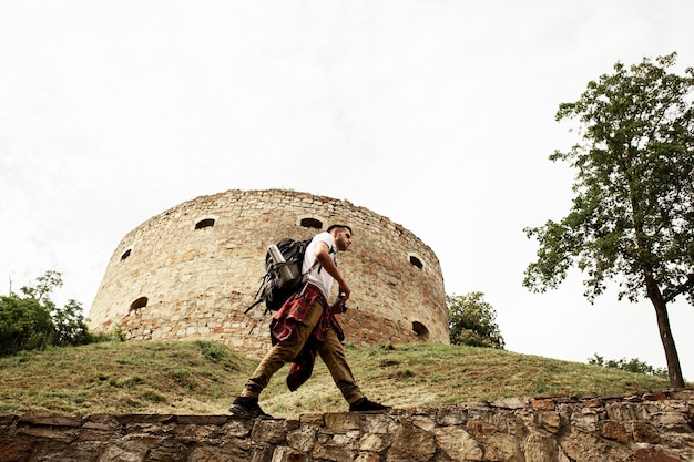 Man taking photos of castle ruins