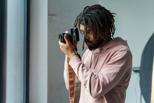 Man taking photos indoors