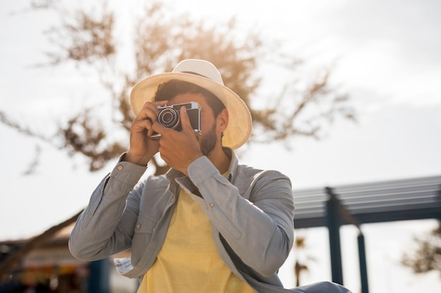 Man taking photos on a sunny day