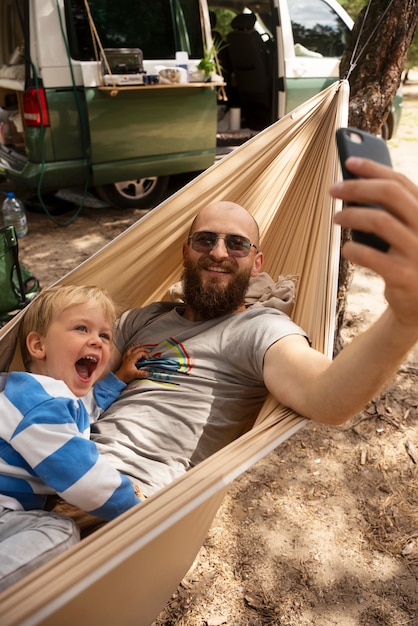 Man taking selfie with kid high angle