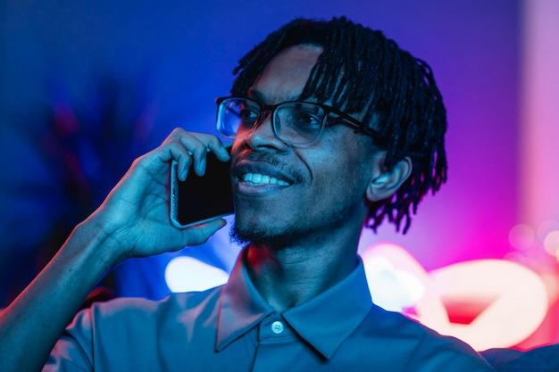 Man talking on smartphone at home