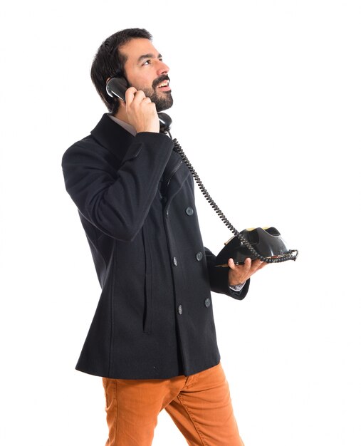Man talking to vintage phone