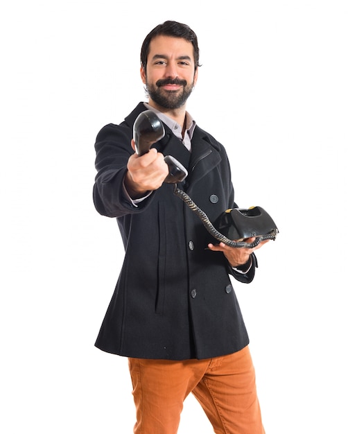 Man talking to vintage phone