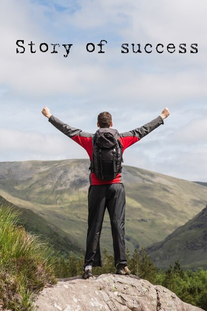 Man on top of a mountain with inspiring phrase
