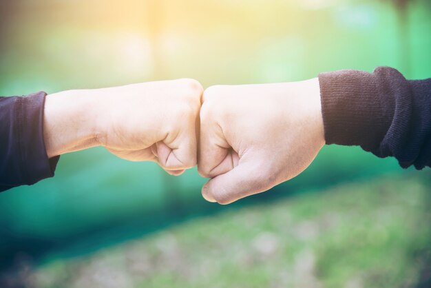 Man touching / holding hand together for success commitment work concept