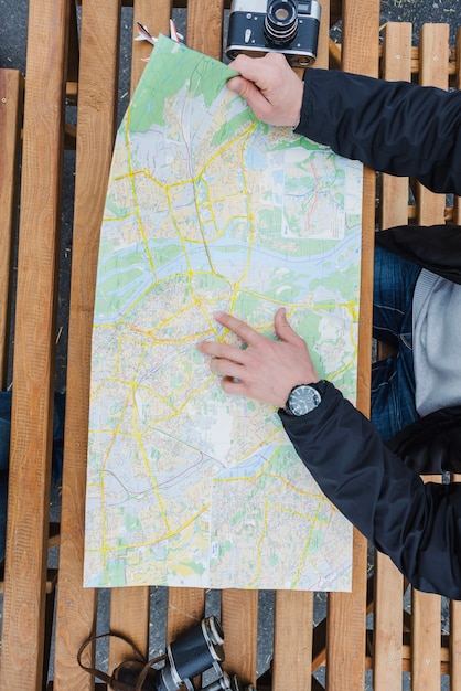 Man tourist navigating at table