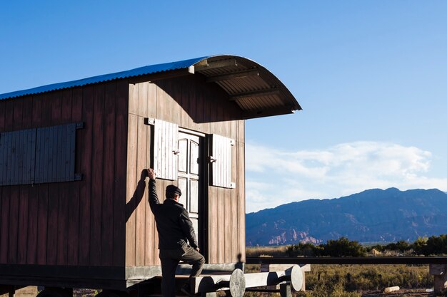 Man on train wagon outdoors