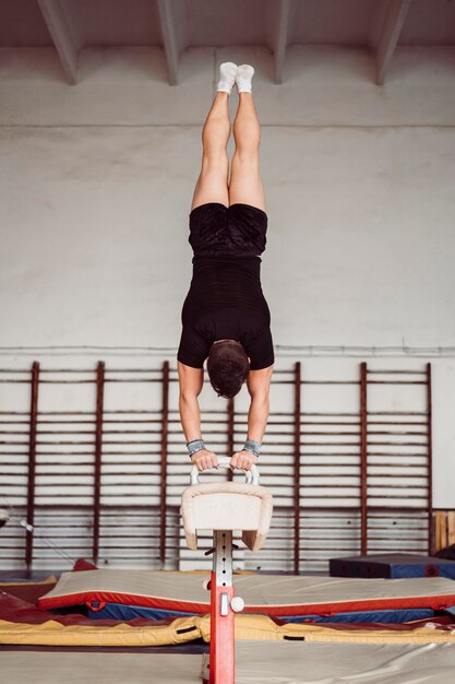 Man training for gymnastics championship