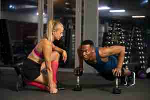 Free photo man training with dumbbells full shot