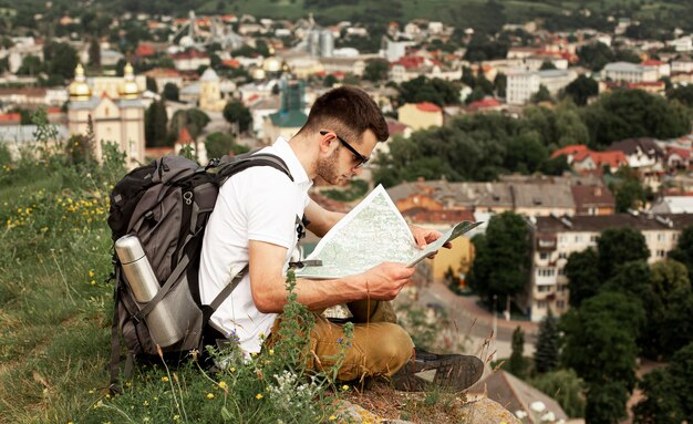 Man traveling alone consulting map