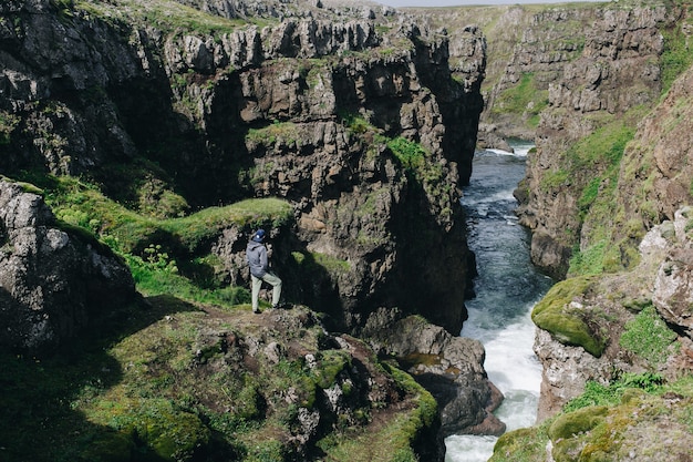 Man traveller walk arund icelandic landscape