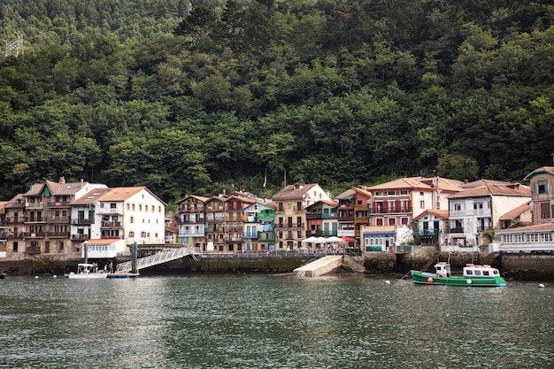 Free photo man travelling by boat in san sebastian