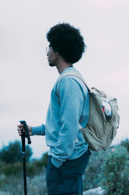 Free photo man trekking in mountains