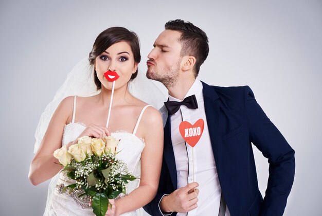 Man trying to kiss his just married woman