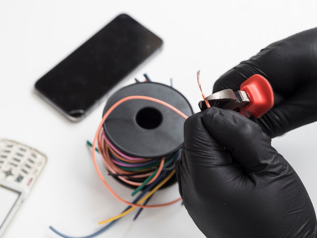 Man using cutters to cut wires