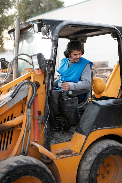 Man using an excavator for digging on day light