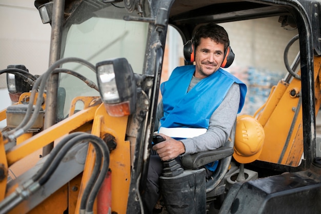 Man using an excavator for digging on day light