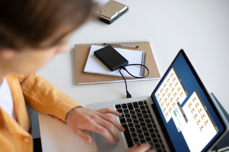 Free Photo man using external storage used
