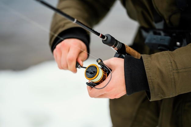 Man using a fishing rod to catch fish