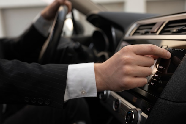 Man using his car's options while driving