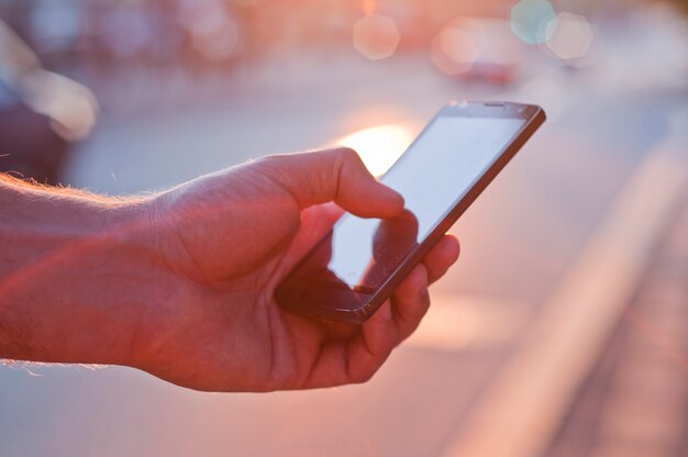 man using mobile smartphone.