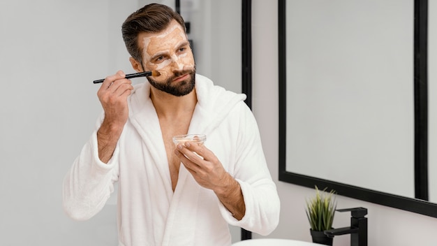 Man using natural ingredients for a face mask