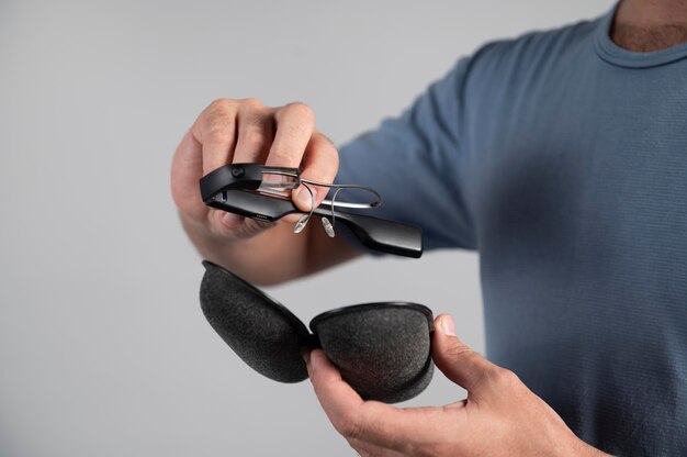 Man using a pair of smart glasses