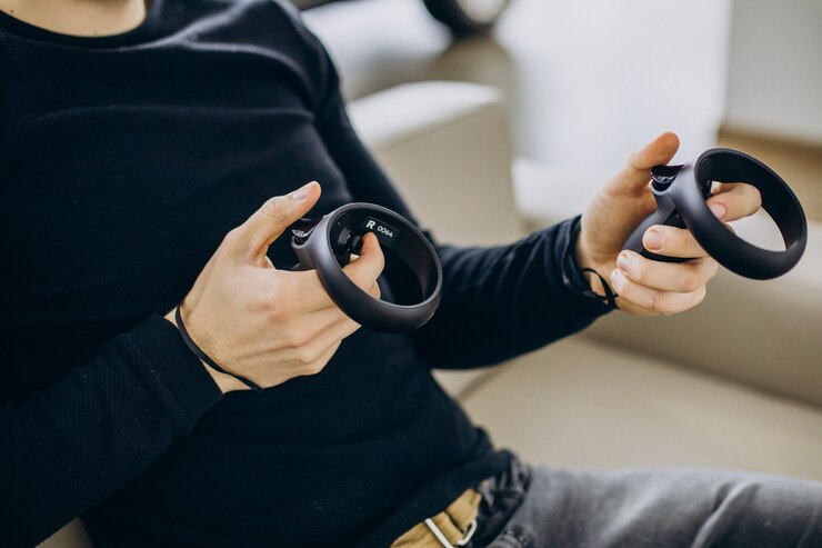 Free Photo man using and playing with vr glasses