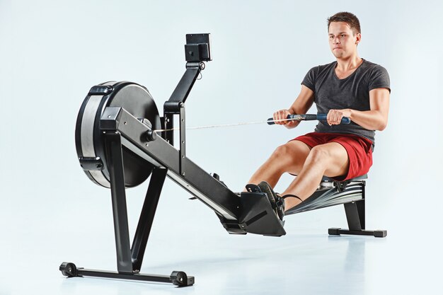 Man Using A Press Machine In A Fitness Club.