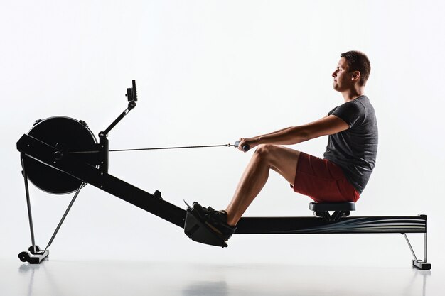 Man Using A Press Machine In A Fitness Club.