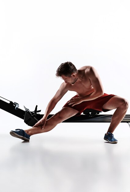 Man Using A Press Machine In A Fitness Club.